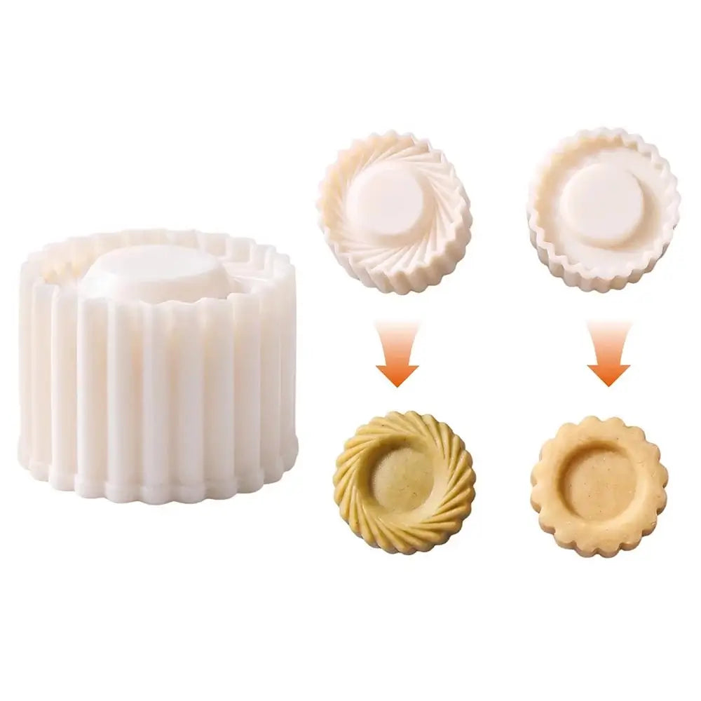 A white plastic cookie cutter shown alongside two example cookie cutout shapes, with orange arrows indicating the cutter creates different decorative round cookie designs.