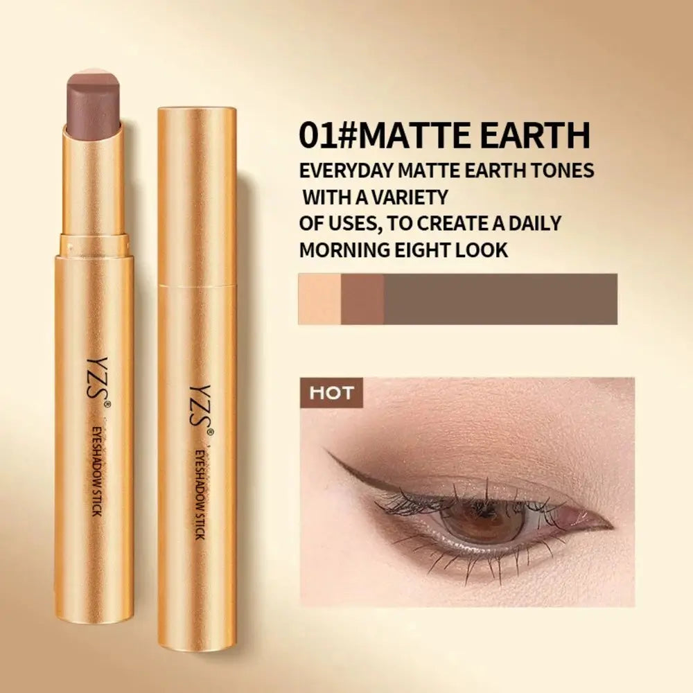 A gold cosmetic stick and its cap shown on a beige gradient background, with text reading '01#MATTE EARTH' and a small eye makeup result photo. The product appears to be an eyeshadow stick in a matte earth-tone shade.
