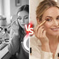 A split-screen comparison showing a woman applying makeup. The left side is in black and white, showing her looking into a ring light at a vanity.