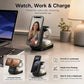 A black wireless charging stand shown on a desk with a laptop, lamp, and plant in a home office setting. The stand holds a smartphone and a smartwatch, with text reading 'Watch, Work & Charge' and feature callouts for landscape/portrait viewing, hands-free use, and desk or nightstand placement.