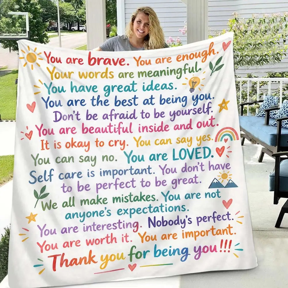 Close-up of the uplifting words printed on the affirmation blanket