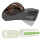 Eagle brand auto tape dispenser shown with a dark translucent top cover and a clear plastic body, alongside two rolls of clear tape with green grid patterns on a white background.