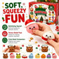 A hand squeezes two cute Christmas-themed squishy toys, one pink with a Santa hat and one white with a red scarf, in front of a box labeled 'Dumpling Advent Calendar' and promotional text about soft, squeezable fun.