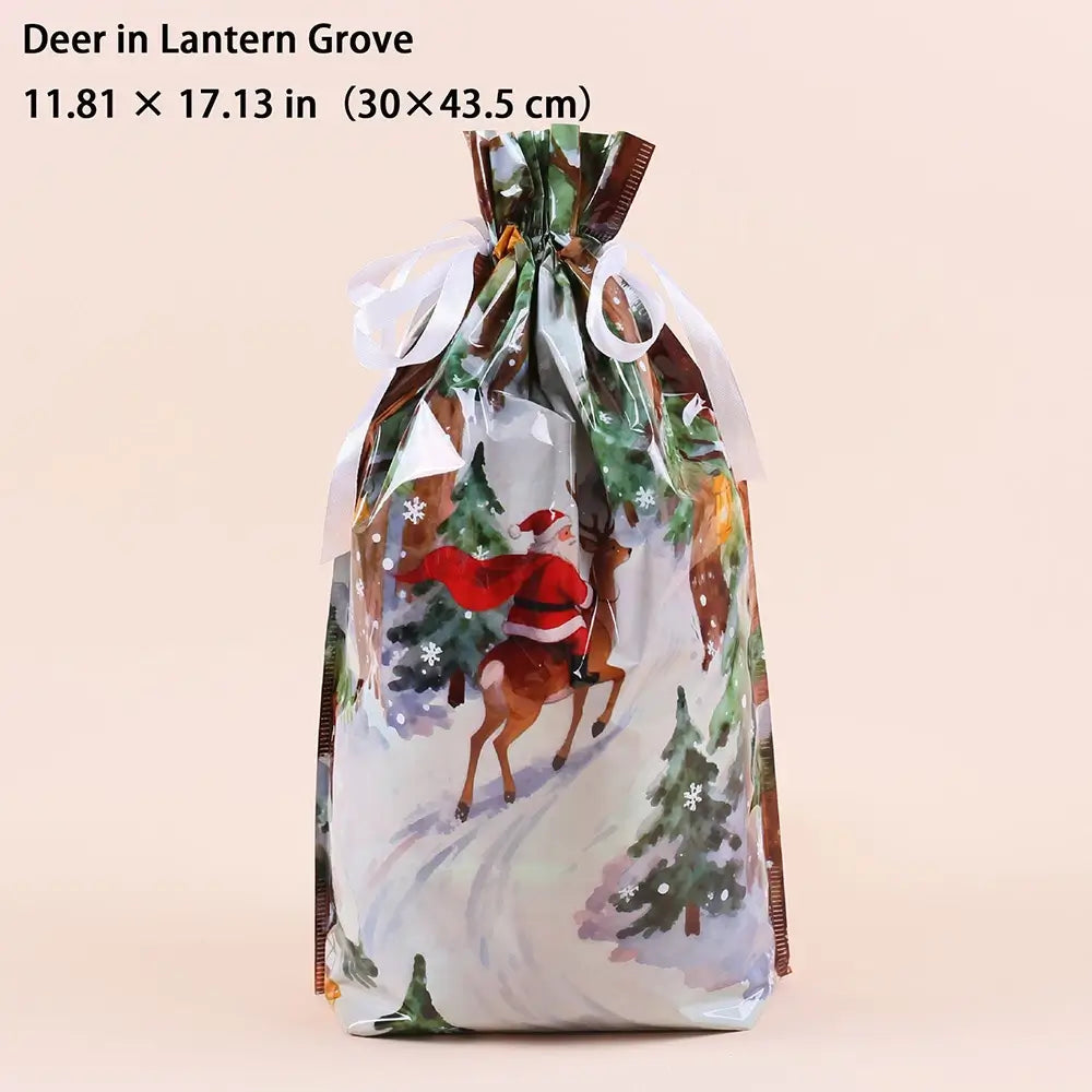 A festive drawstring gift bag with a printed winter scene featuring Santa Claus on a deer, evergreen trees, and snowy ground. The bag is shown against a solid pale peach background with text at the top reading 'Deer in Lantern Grove