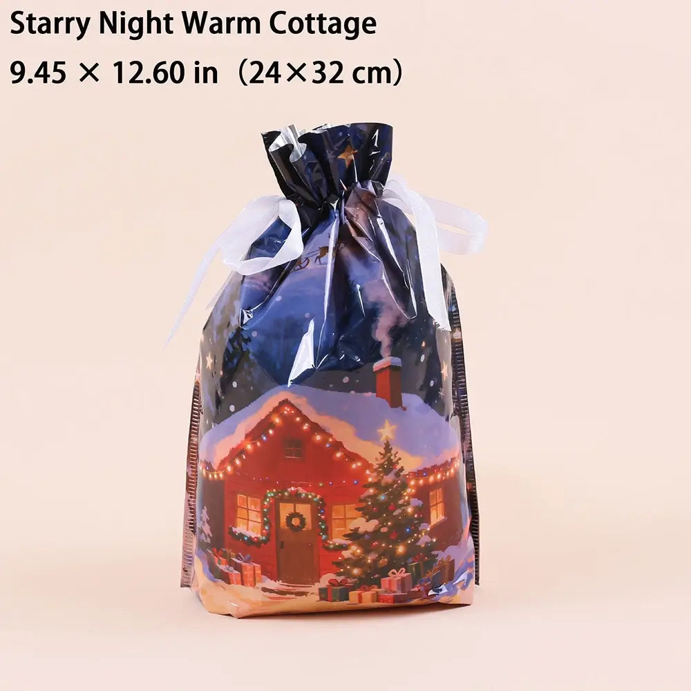 A clear plastic drawstring gift bag with a printed winter cottage scene, shown on a plain light beige background. Text at the top reads 'Starry Night Warm Cottage'