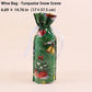 A green Christmas-themed wine bag with a turquoise snow scene print, featuring a white ribbon tied around the neck, shown on a light beige background with text indicating its size.