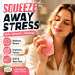 A woman holds a pink, squishy stress ball in a softly lit indoor setting, with large promotional text reading 'SQUEEZE AWAY STRESS' and feature callouts about stress relief, focus, and coconut oil filling.