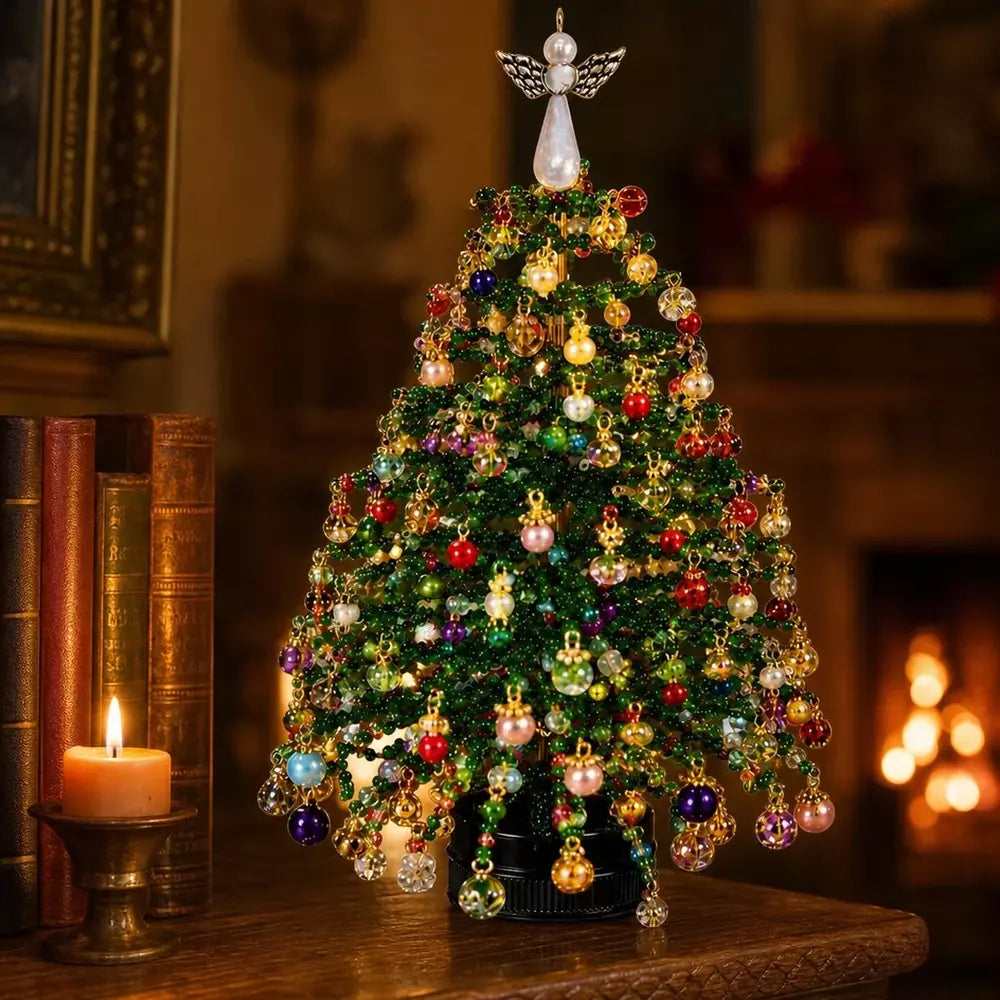 Finished beaded Christmas tree displayed as a festive tabletop decoration