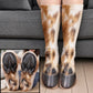 Brown and white horse fur hoof socks worn on legs before a gray sofa with a sole closeup