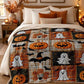 Halloween-themed flannel blanket styled on a bed