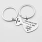 Two silver keychains with heart-shaped pendants on a light gray background