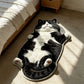 Floor rug printed with a realistic image of a lying cow cat