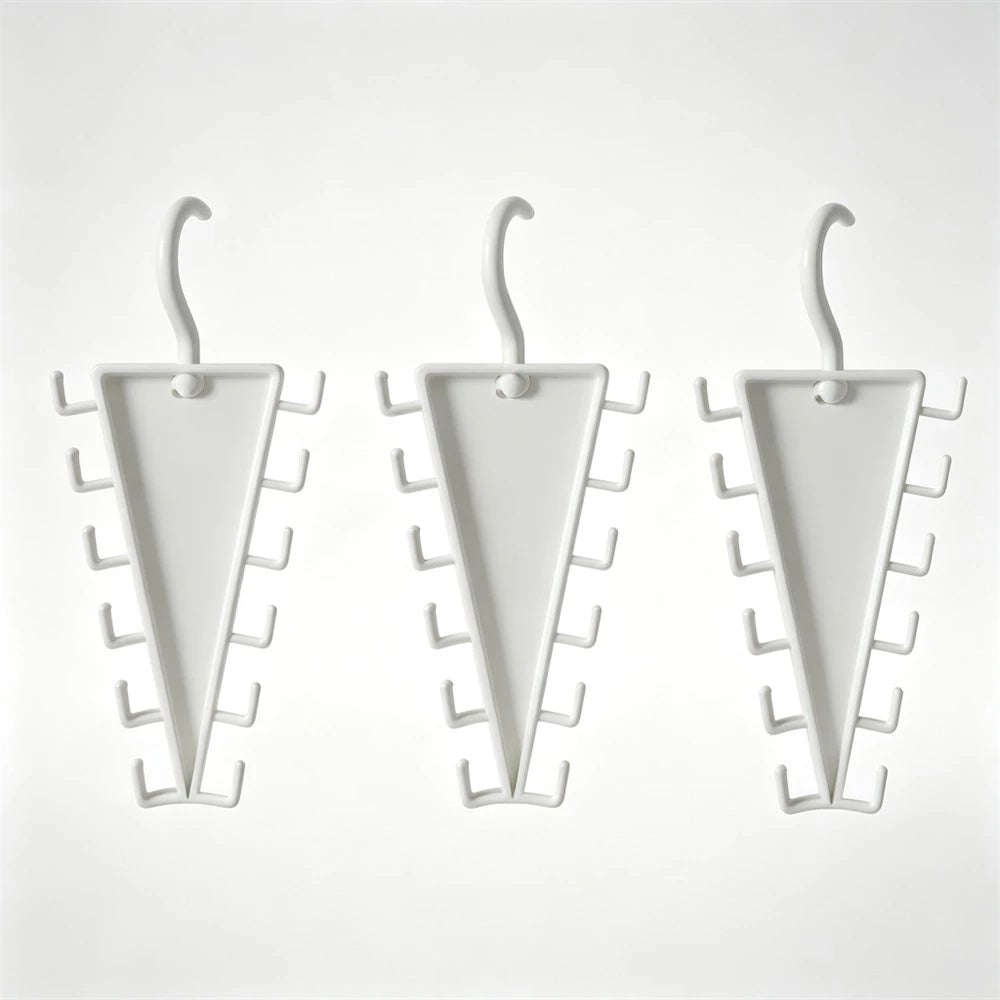 Three white triangular wall hooks with multiple small side hooks, shown on a plain light background.