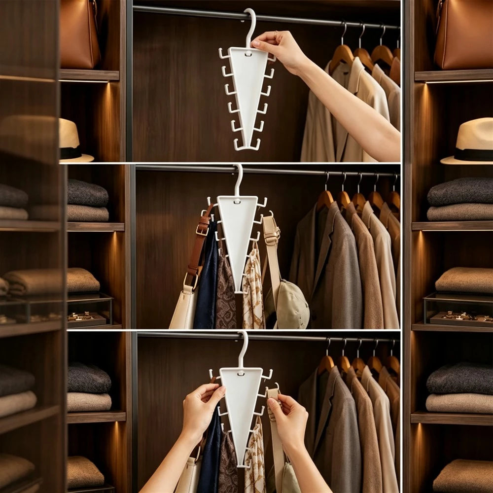 A white triangular multi-hanger closet organizer shown in three stacked panels being hung on a wardrobe rod inside a closet. A person's hand and arms are visible holding the hanger, and the closet shelves around it contain folded clothes, bags, and hats.