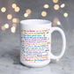 A white ceramic mug with colorful printed positive affirmation text.
