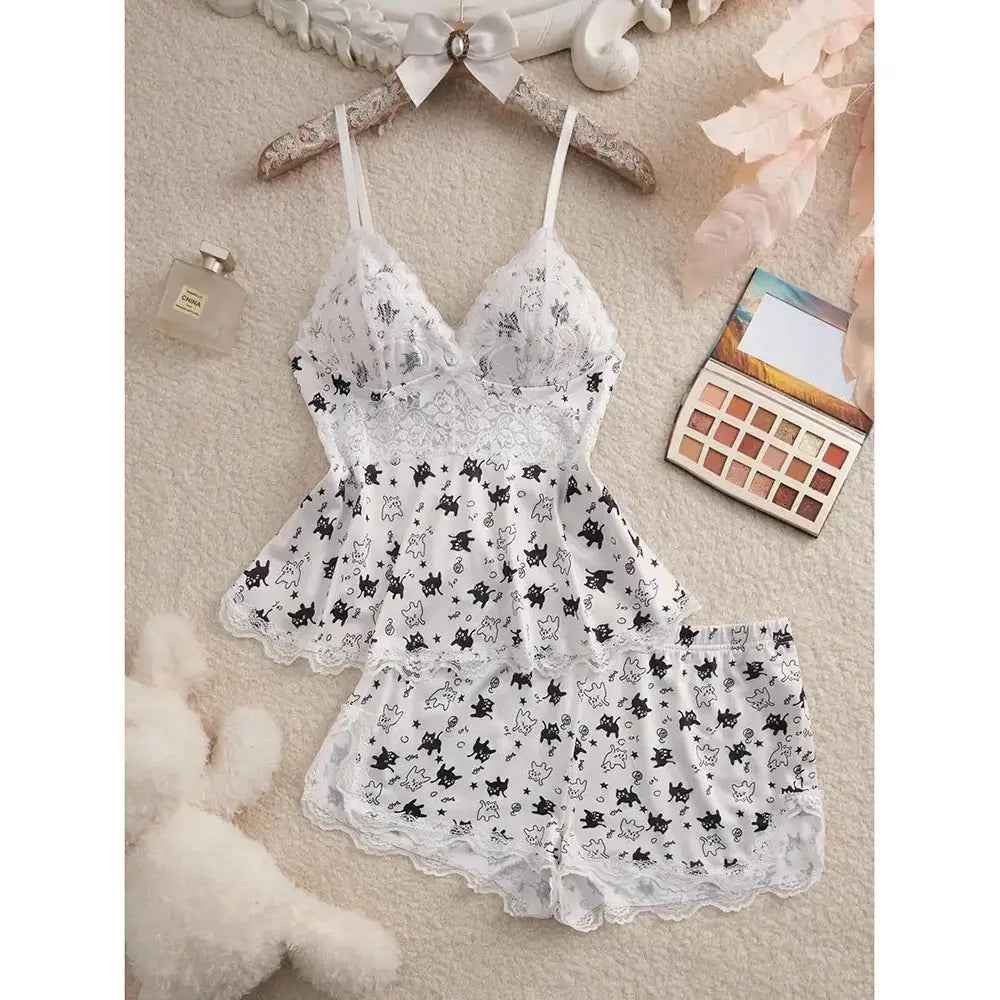 White women's Halloween pajama set with black cat and spooky character print