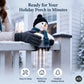 A snowman-shaped holiday porch light with a black hat, blue scarf, and glowing face is clipped onto a white railing in a snowy outdoor setting. A person's gloved hand is holding it in place.