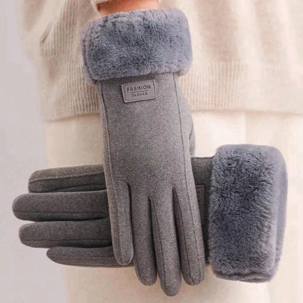 Gray fleece winter gloves with plush faux-fur trim on the cuffs, shown on a person wearing a cream knit sweater. 