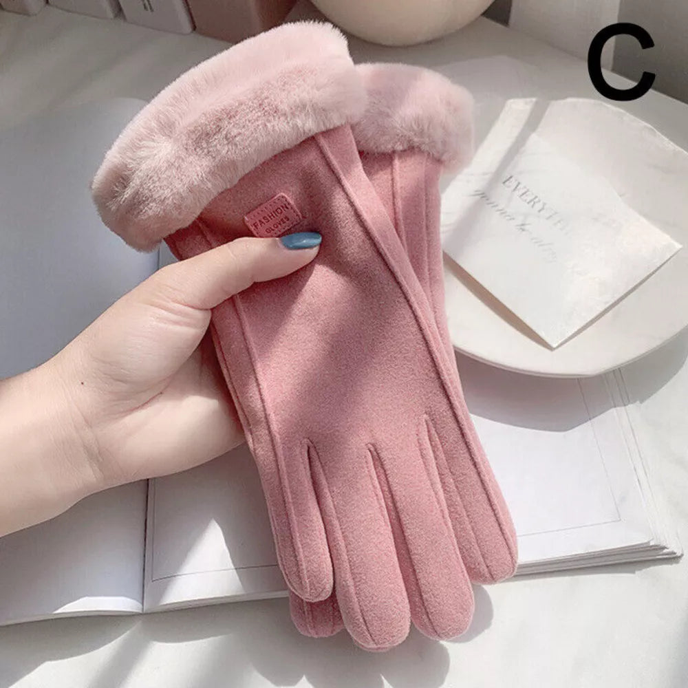 A pink faux-leather glove with a fluffy faux-fur cuff, held by a hand over an open book.