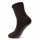 A single dark brown ribbed knit slipper sock with gray grip dots on the sole, shown against a plain white background.