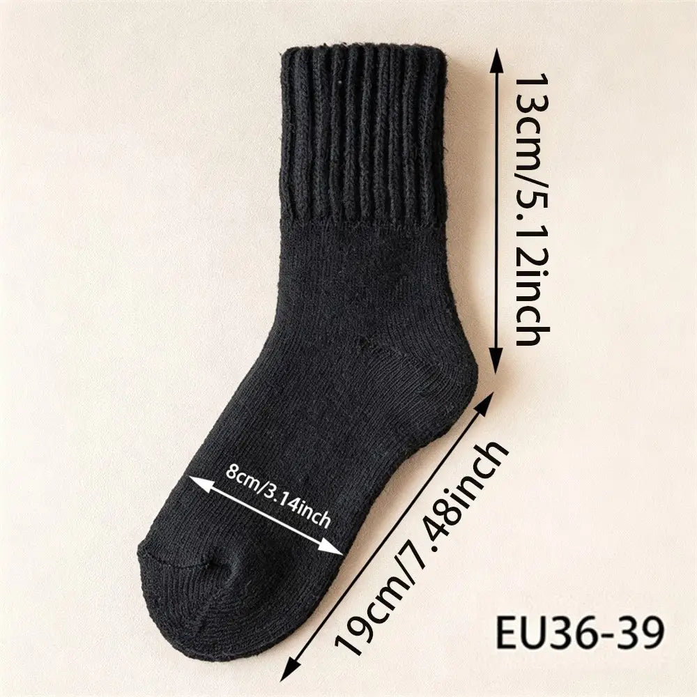 A single black ribbed knit sock shown on a light beige background with overlaid dimension arrows and text indicating measurements: 13 cm / 5.12 inch height, 19 cm / 7.