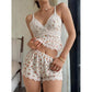 Women's floral pajama set with lace tank top and matching elastic shorts